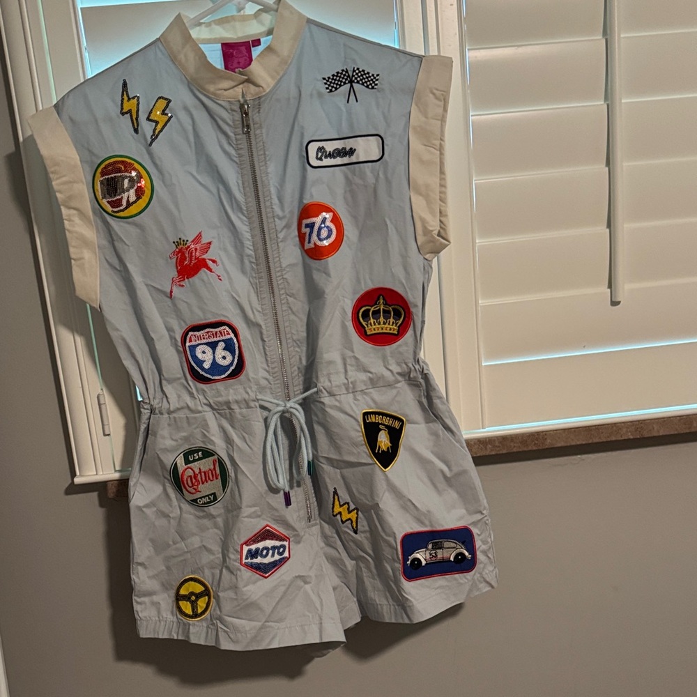 Gray Romper with racing patches.